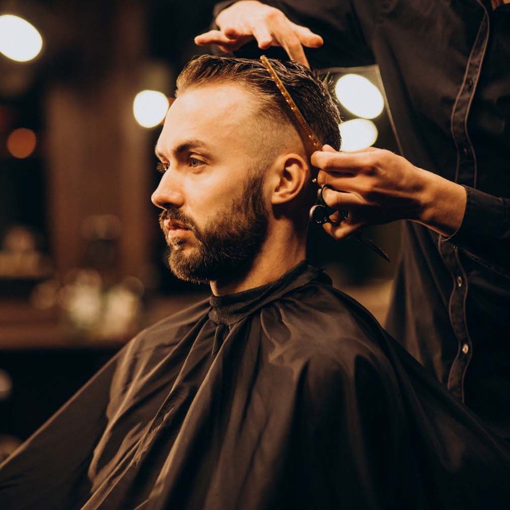 young-man-cbarbershop-trimming-hair
